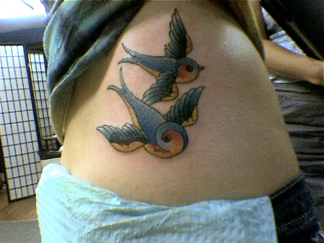 Hand Tattoo Of Birds · Birds tattoo on side