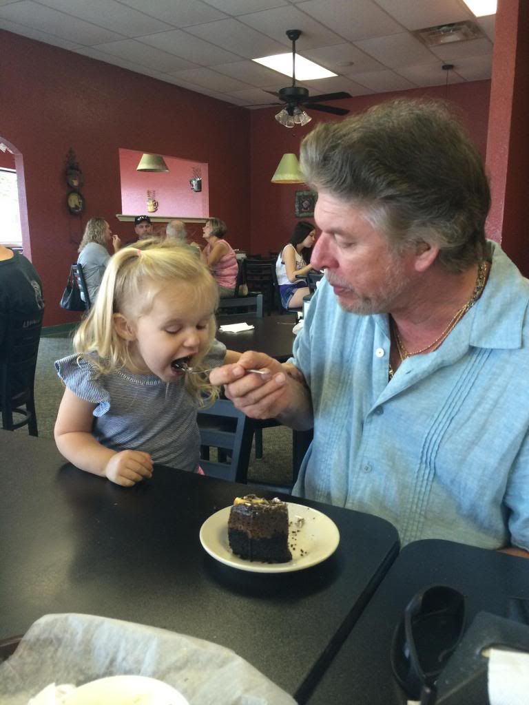 mackenzie eating cake with grandpa